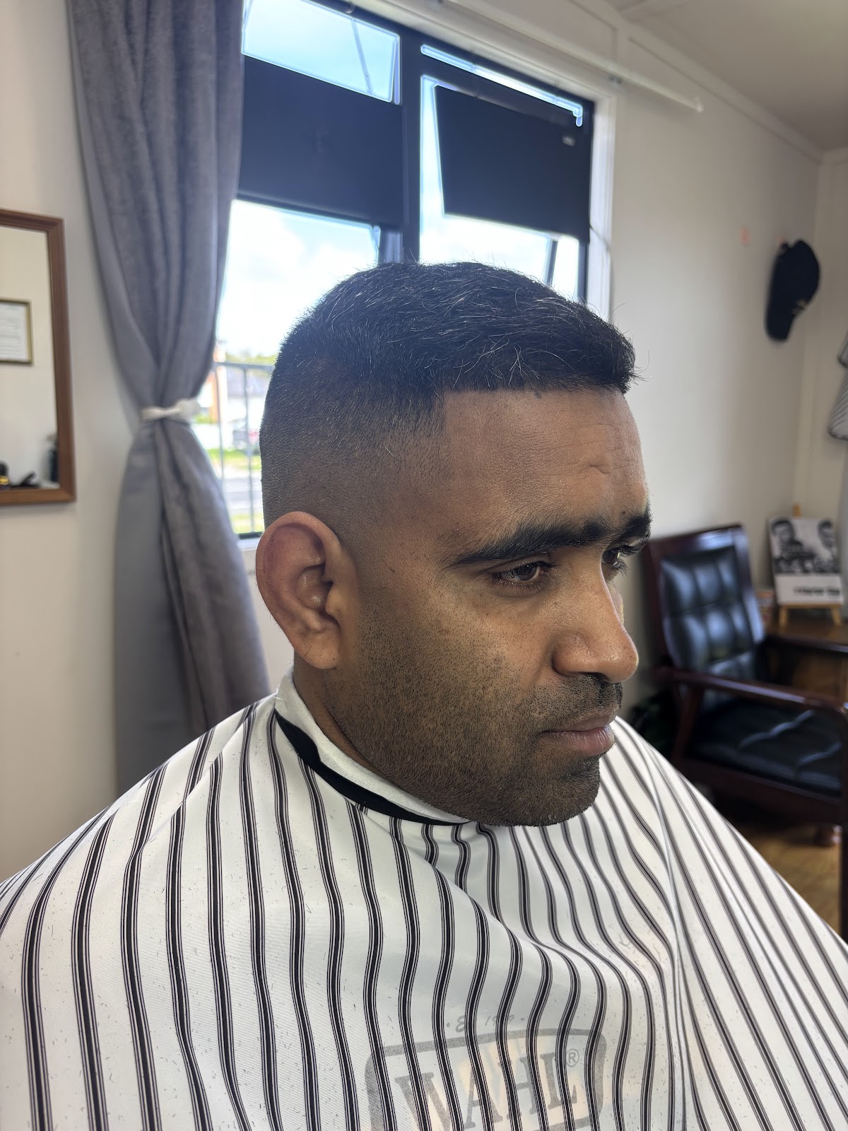 A box fade with a clean lineup, cut by the window at Signature Barbershop